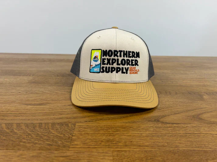 Trucker cap embroidered with the Northern Explorer Supply logo.