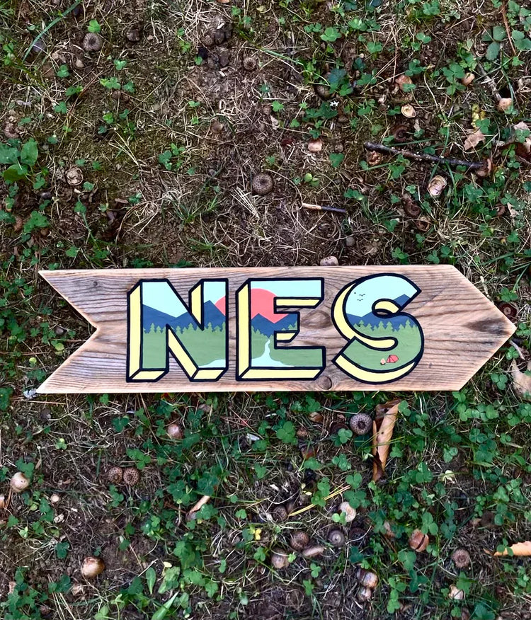 A wooden trail sign made by Pierce Smith of Cape Neddick, Maine..