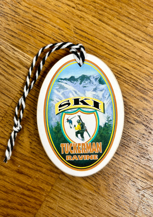 Tuckerman Ravine Skiing Christmas ornament by Gallery Concepts. This souvenir depicts the backcountry skiing and boarding at Tuckerman's in Pinkham Notch. Painted and assembled in Maine.