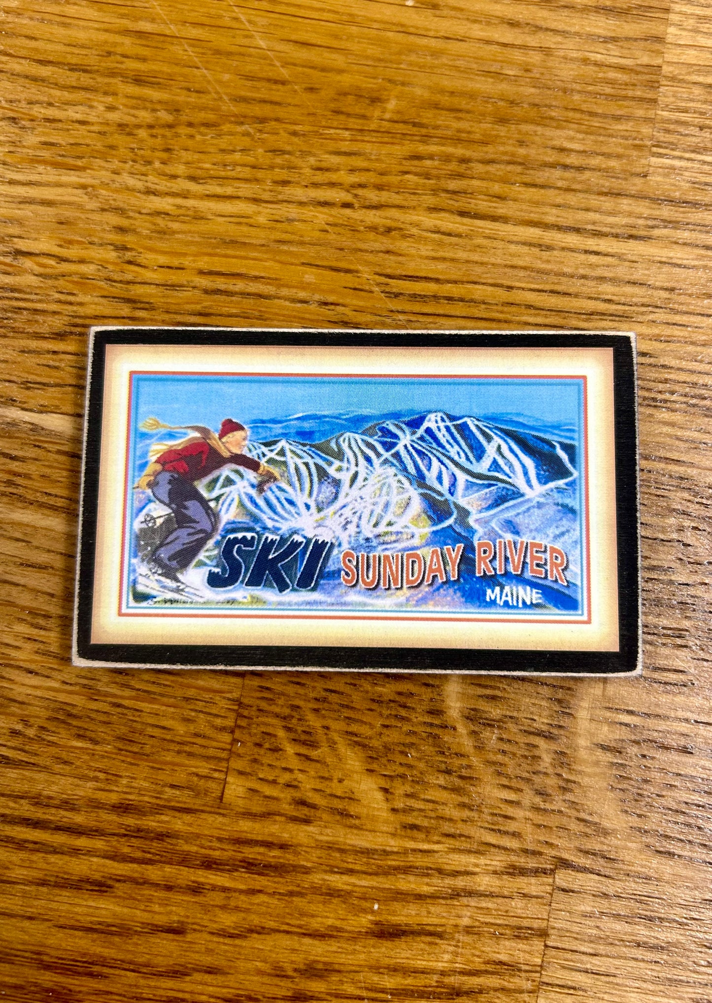 Sunday River is a four season resort in the mountains of Maine This souvenir is a magnet made by hand by Gallery Concepts in Maine. Give a gift of skiing and snowboarding heritage this winter.